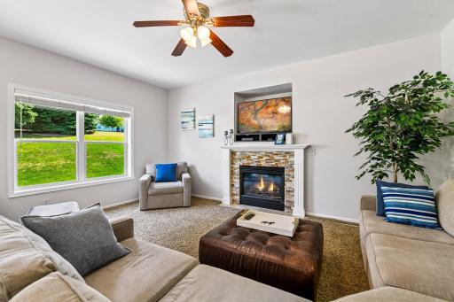 Located just off the kitchen/informal dining room is the family room featuring a stack stone gas fireplace!