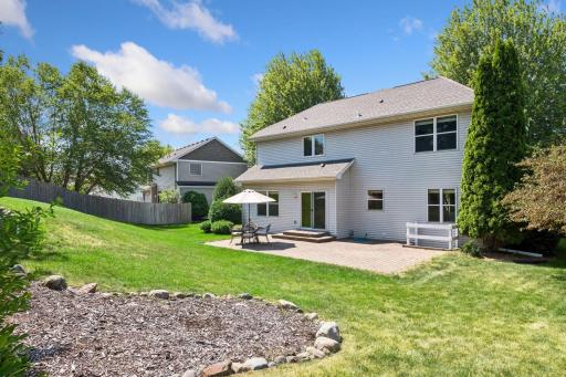 View of the back, great entertaining paver patio and room to play games.