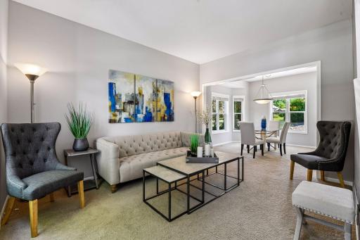 The spacious living and dining room is conveniently located just off the entryway, creating a welcoming first impression and an ideal space for everyday living and entertaining.