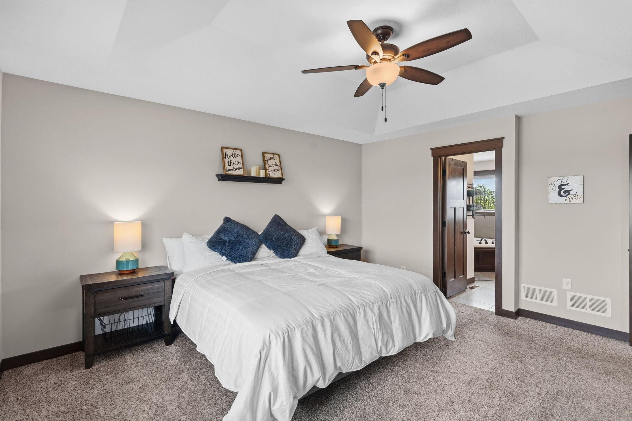 Bright primary bedroom offering generous space and a private ensuite bath.