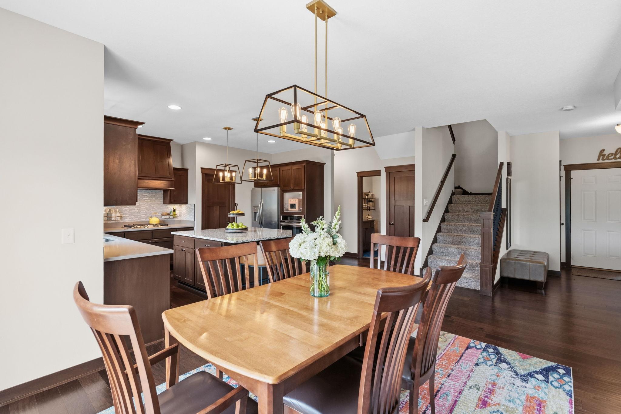 Open-concept dining area seamlessly connected to the kitchen and main living spaces.