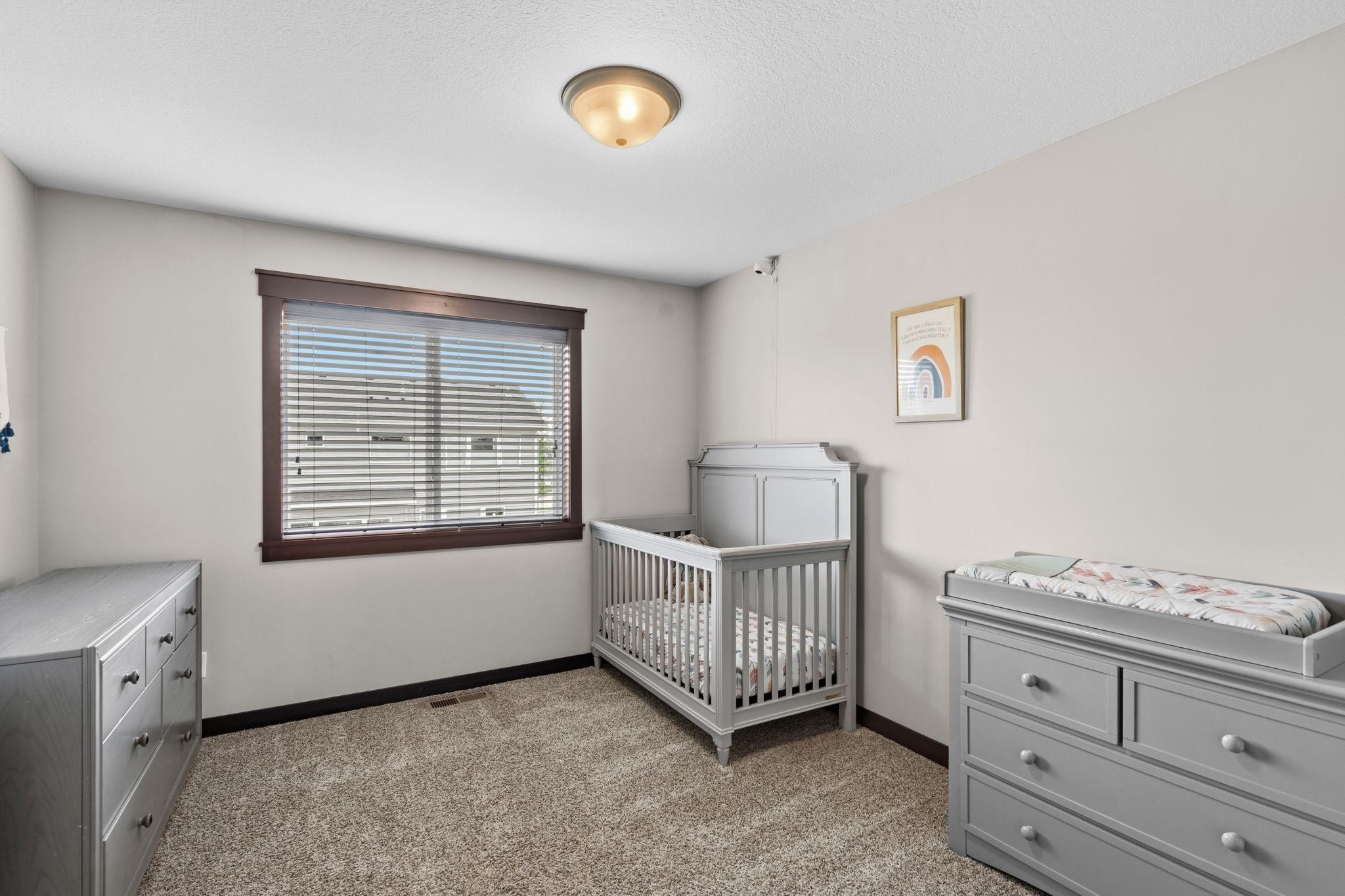 Versatile secondary bedroom with ample space for family, guests, or a home office.