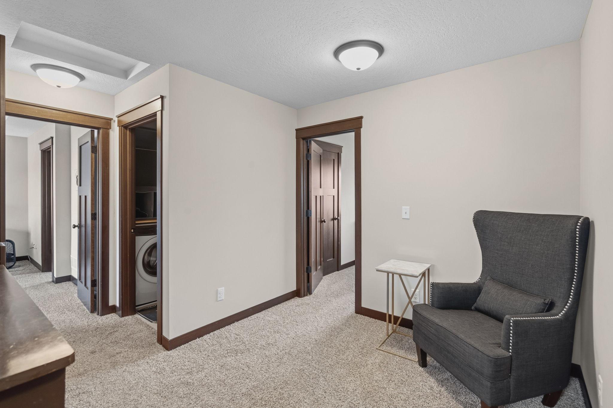 Versatile upper-level loft offering flexible space for a TV watching, home office, play area or homework nook.