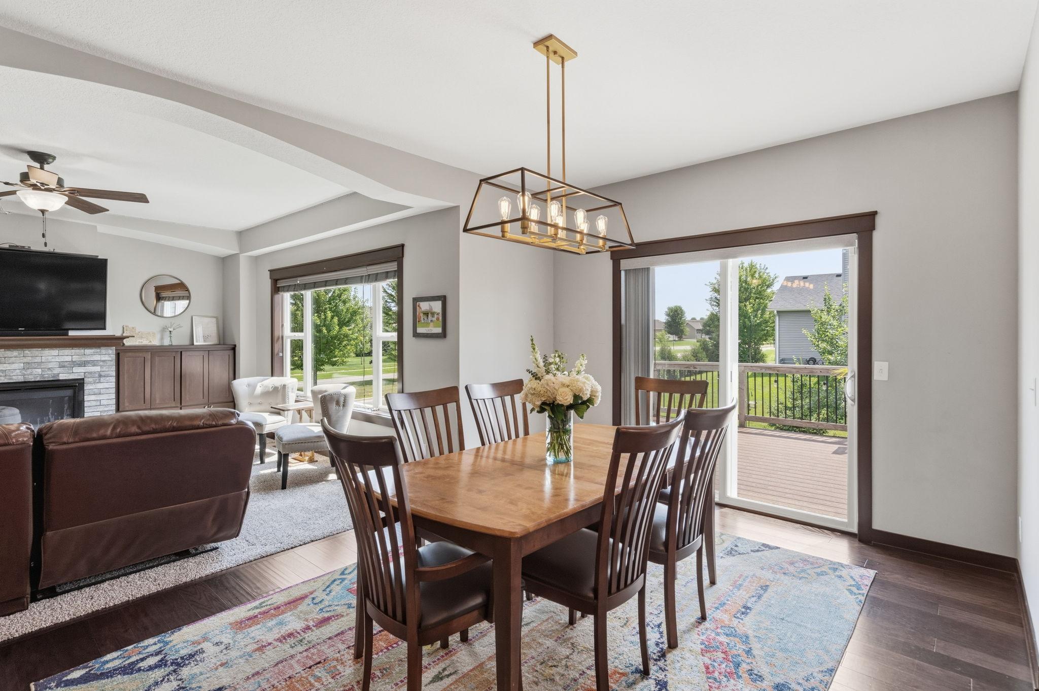 Dining area with sliding glass doors leading to the backyard deck.