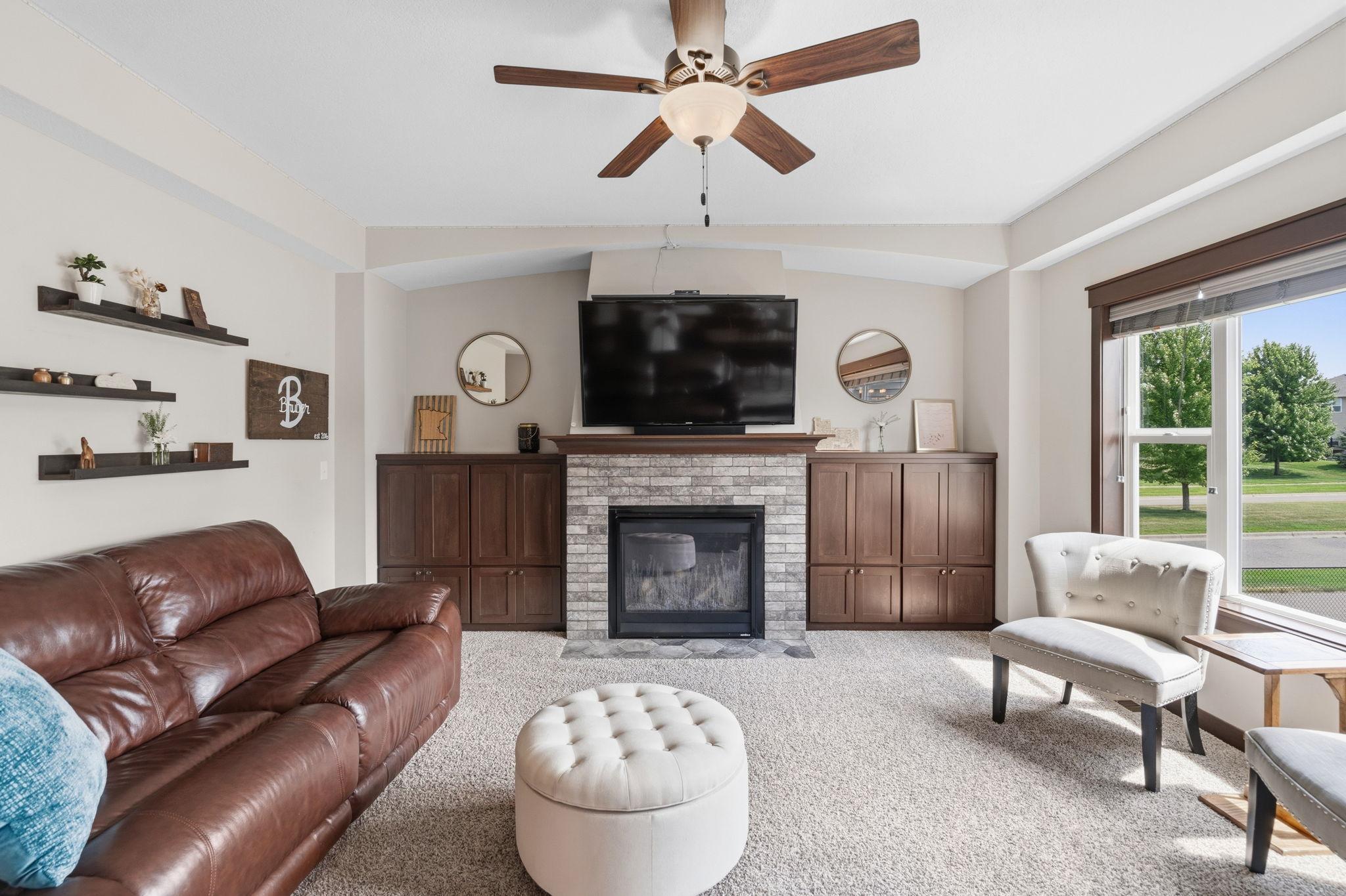 Inviting living room with fireplace, built-ins, and plenty of space for entertaining.