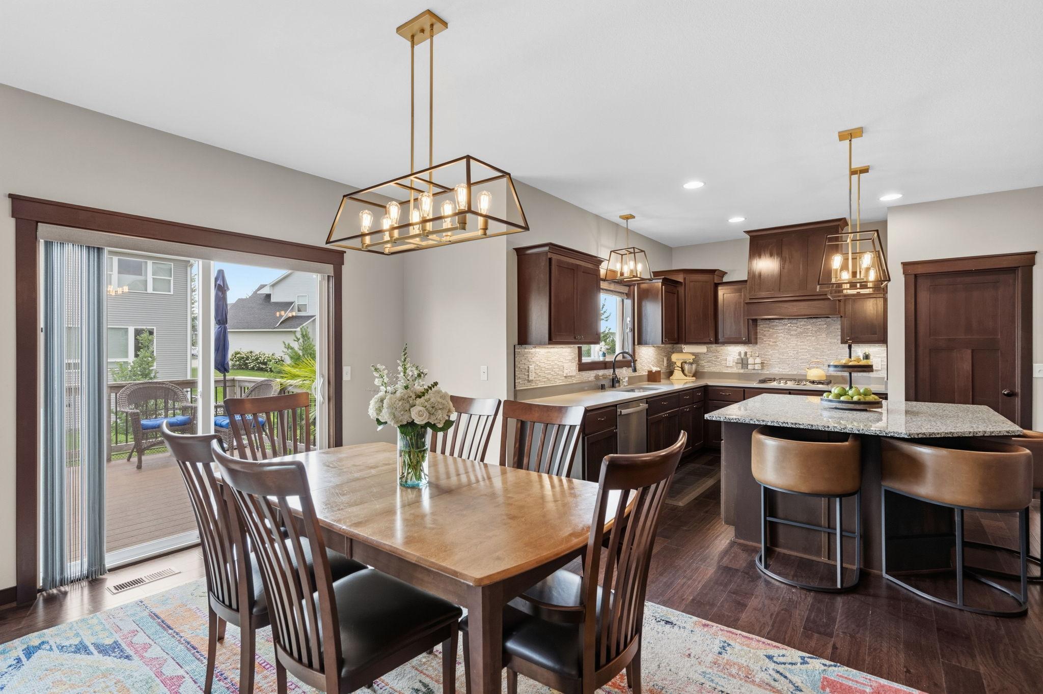 Dining area overlooking the beautifully appointed kitchen with center island.