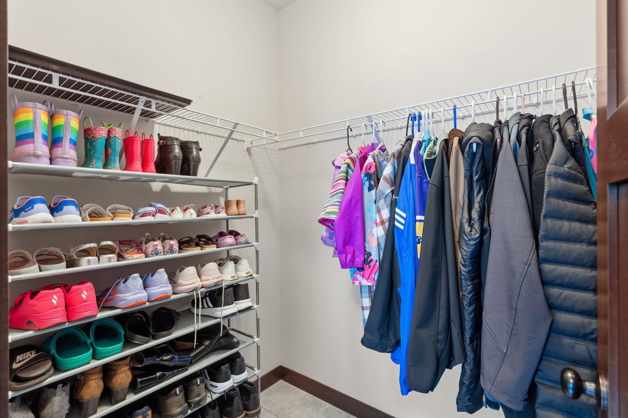 Spacious walk-in closet with custom shelving and abundant storage.