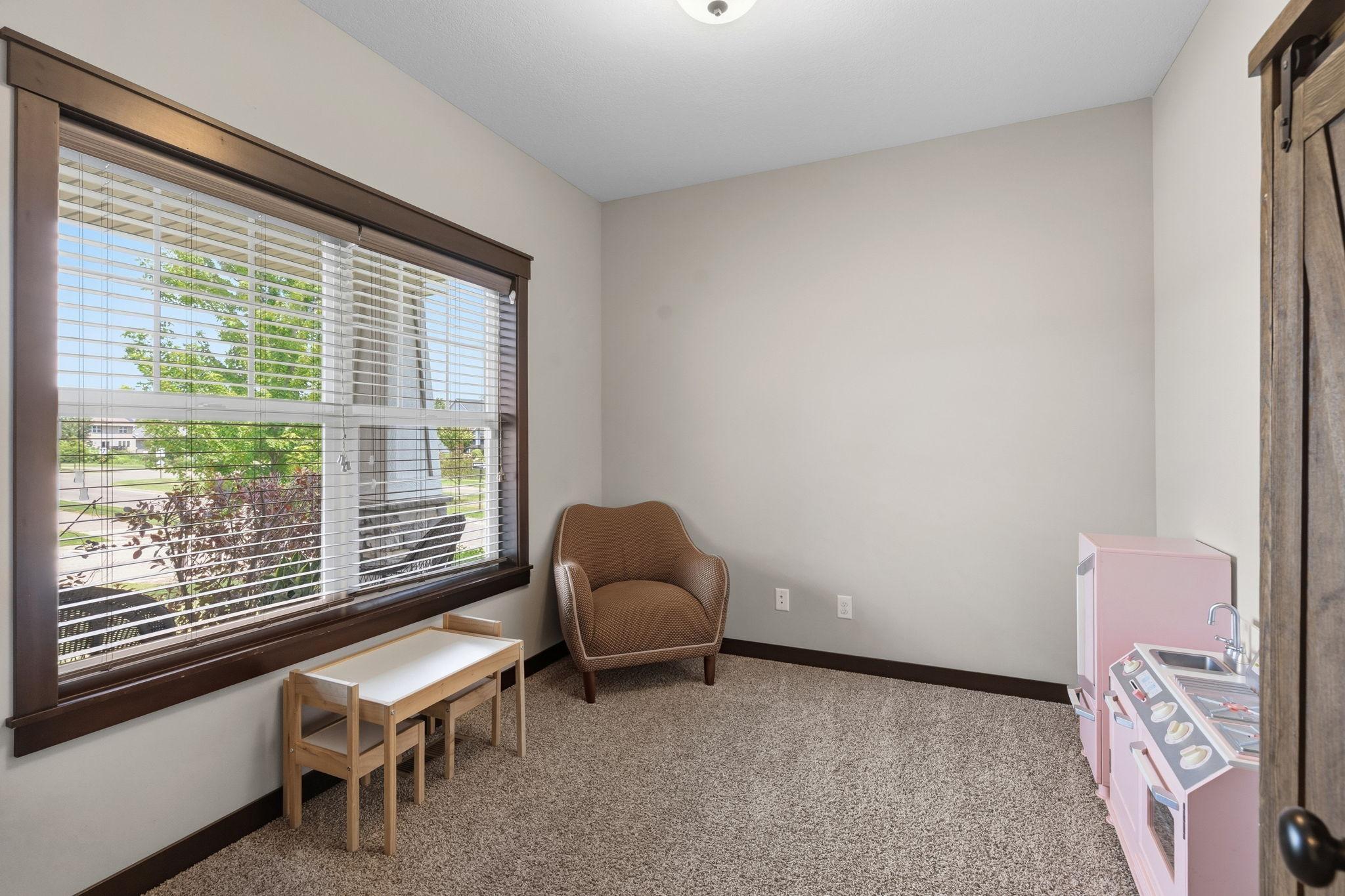Versatile main-level flex space with abundant natural light.