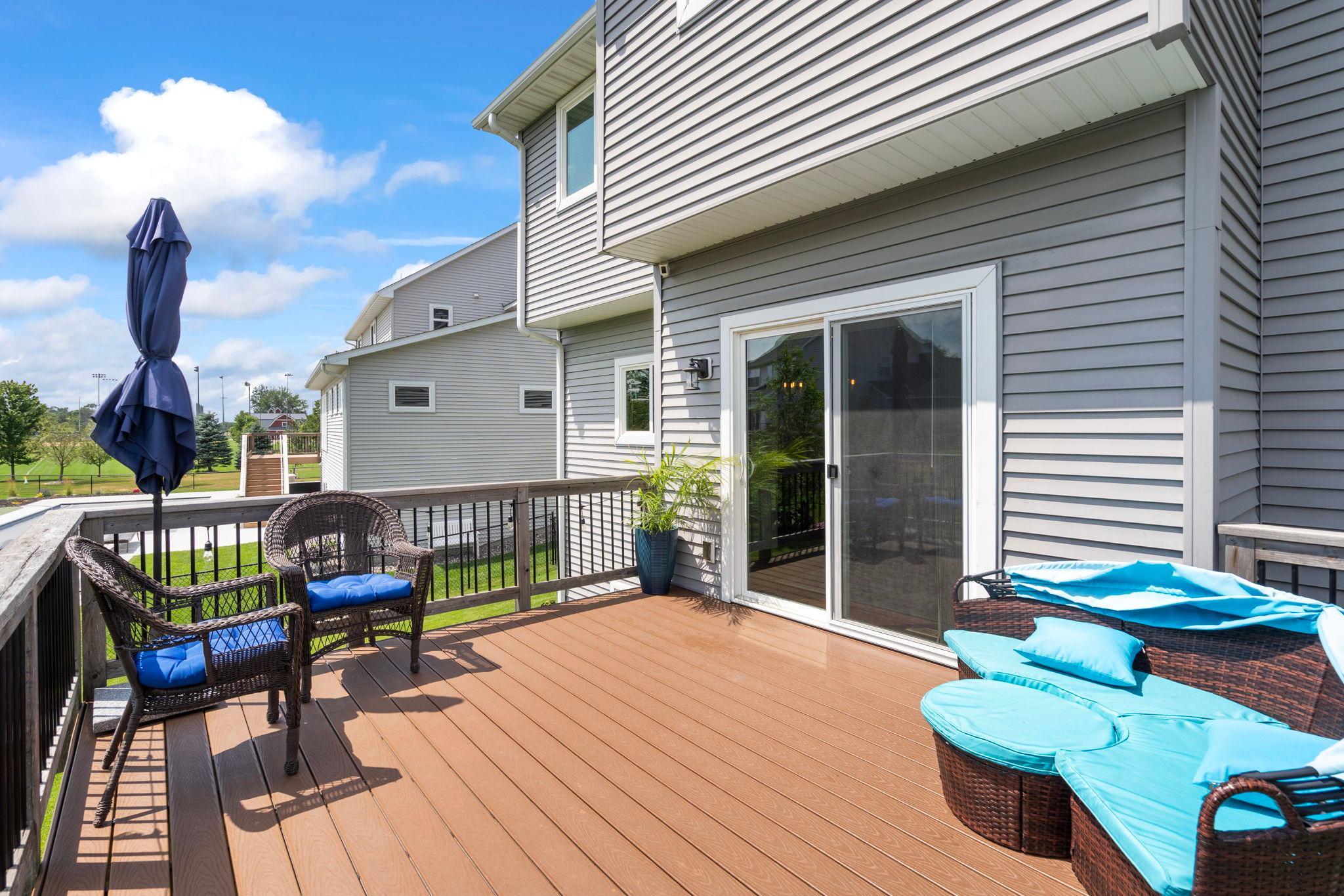 Spacious deck with easy access from the dining area, perfect for outdoor entertaining.