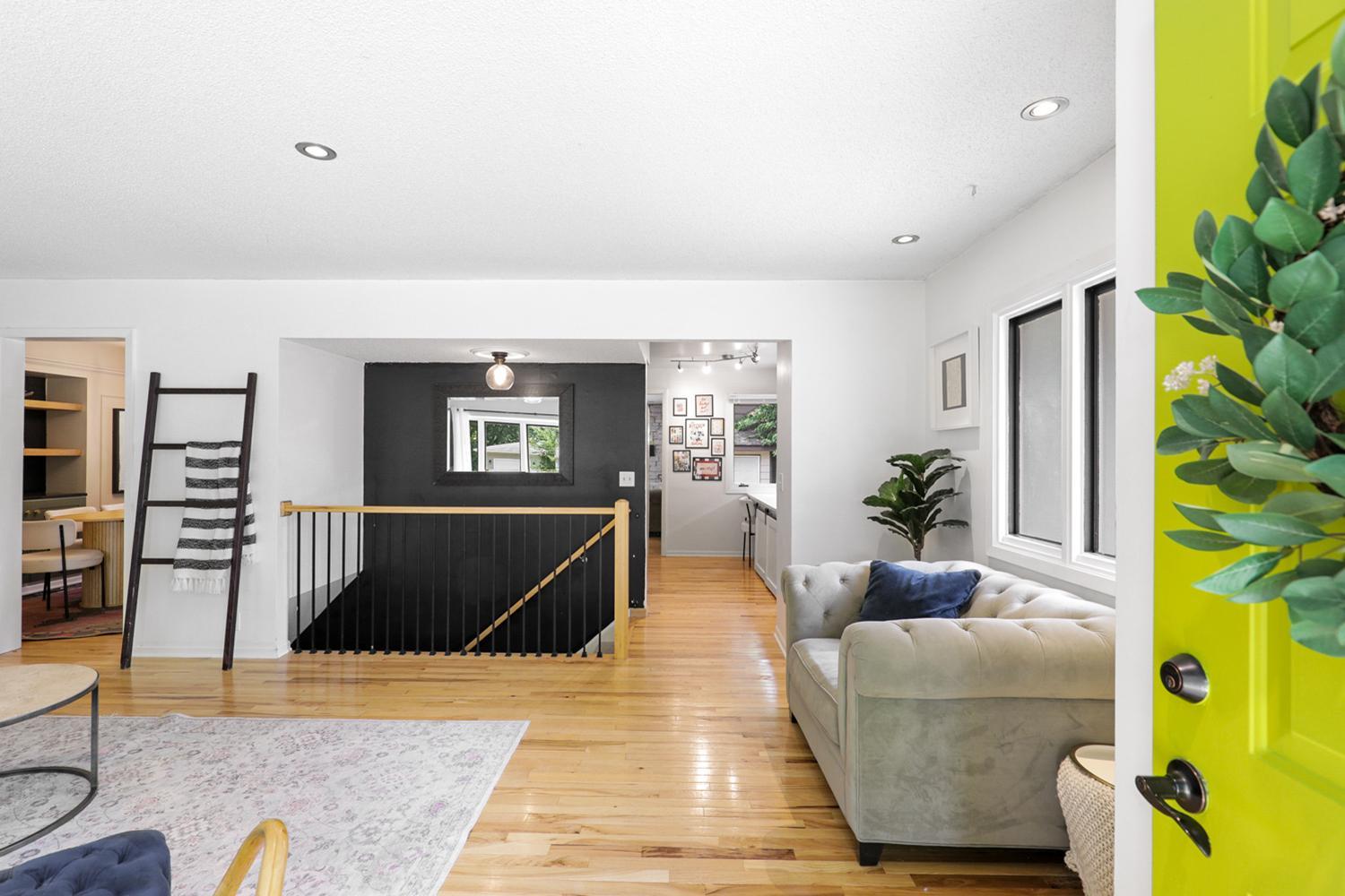 Real wood flooring flows throughout the open concept upper level