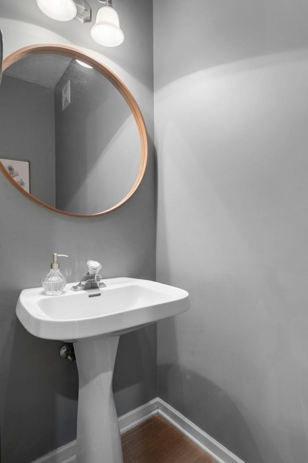 A nearby half bathroom adds additional convenience.