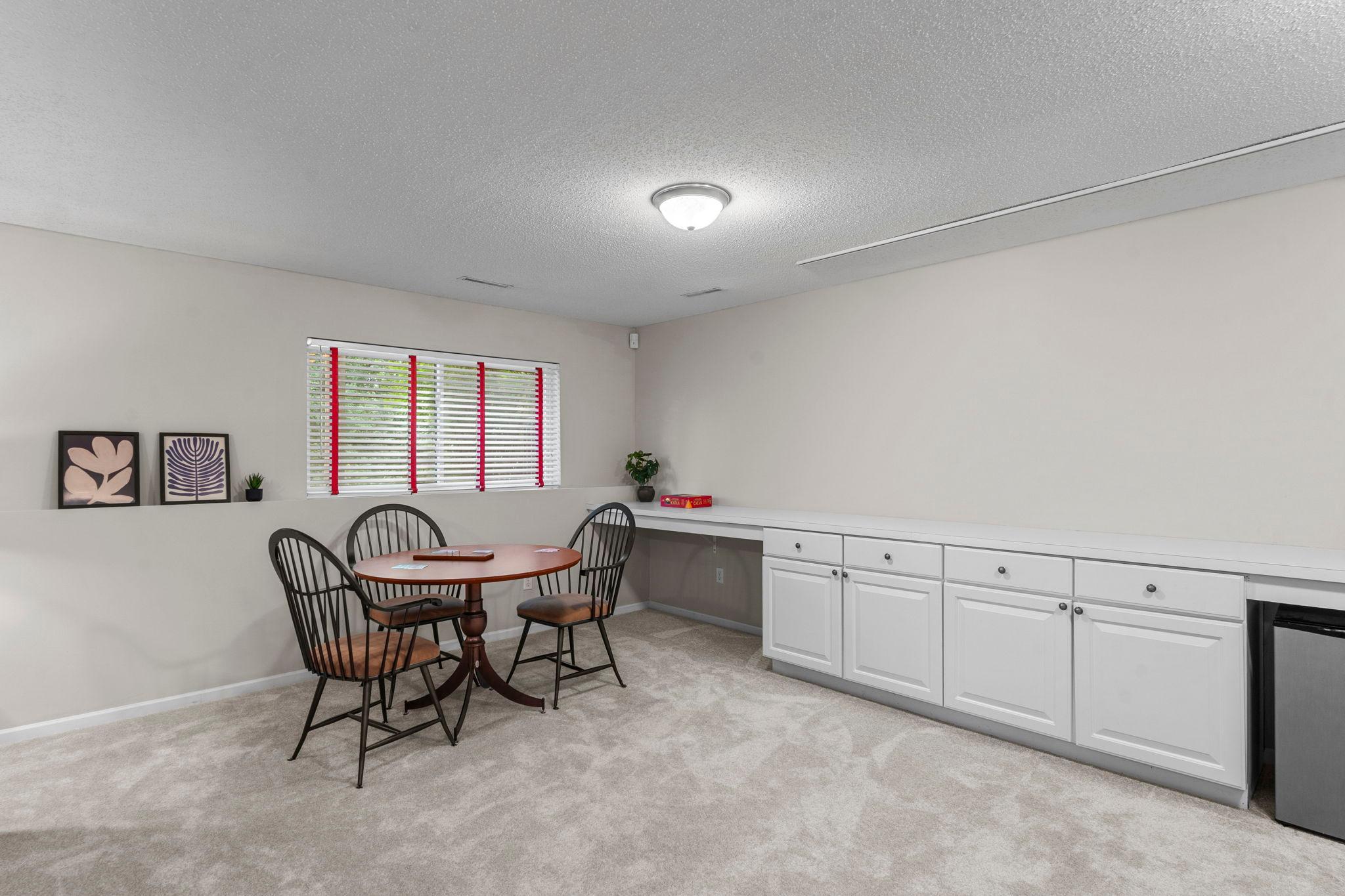 The space includes built-in counter space and cabinetry, creating an ideal workspace or hobby area.