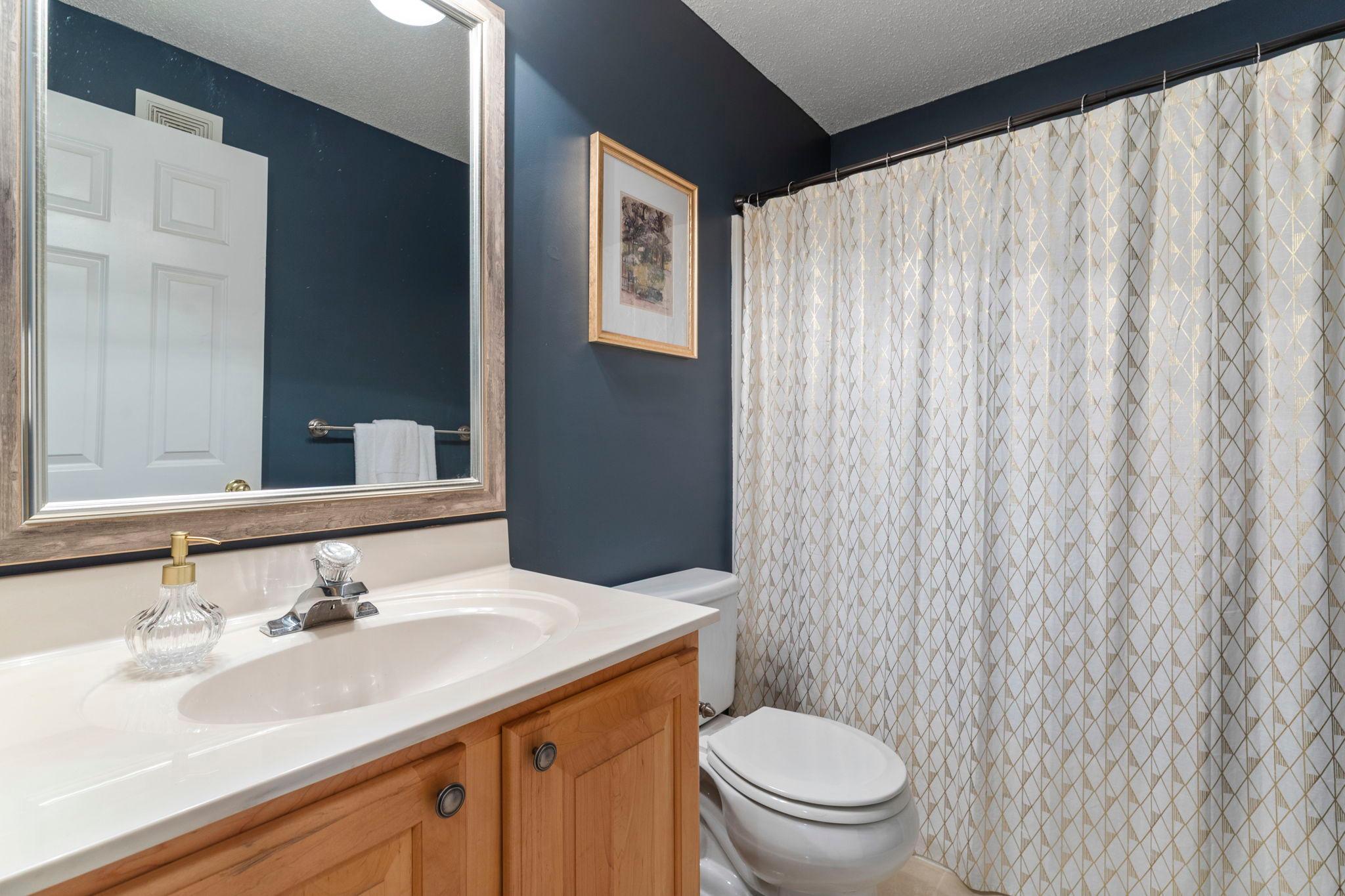 Completing the lower level is a well-appointed full bathroom with a single vanity and tub/shower combination.