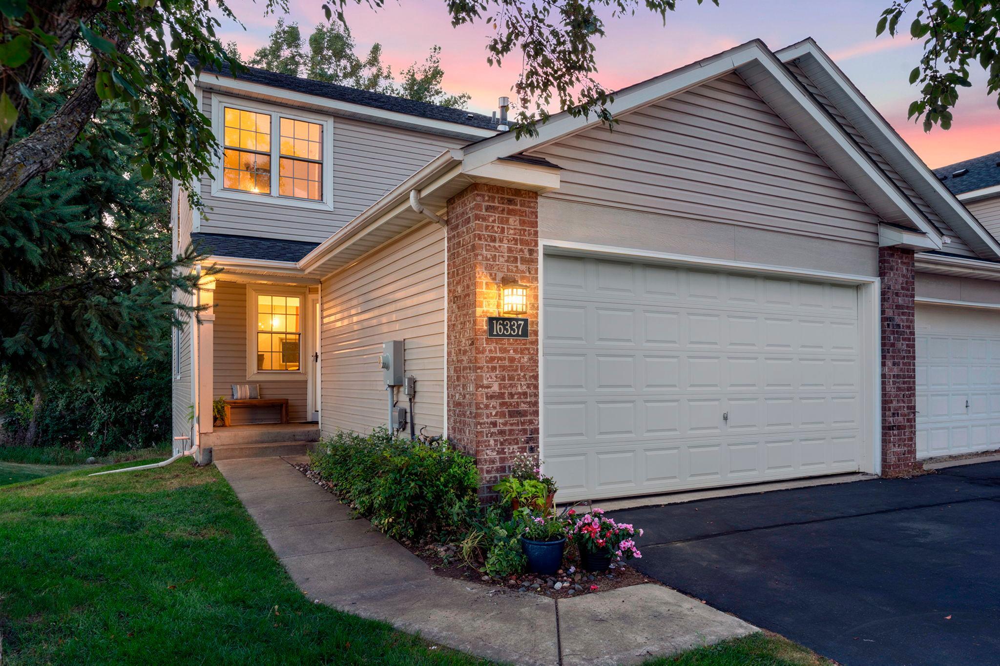 Welcome to this stunning three-bedroom, four-bathroom end-unit townhome located in a quiet Lakeville community.