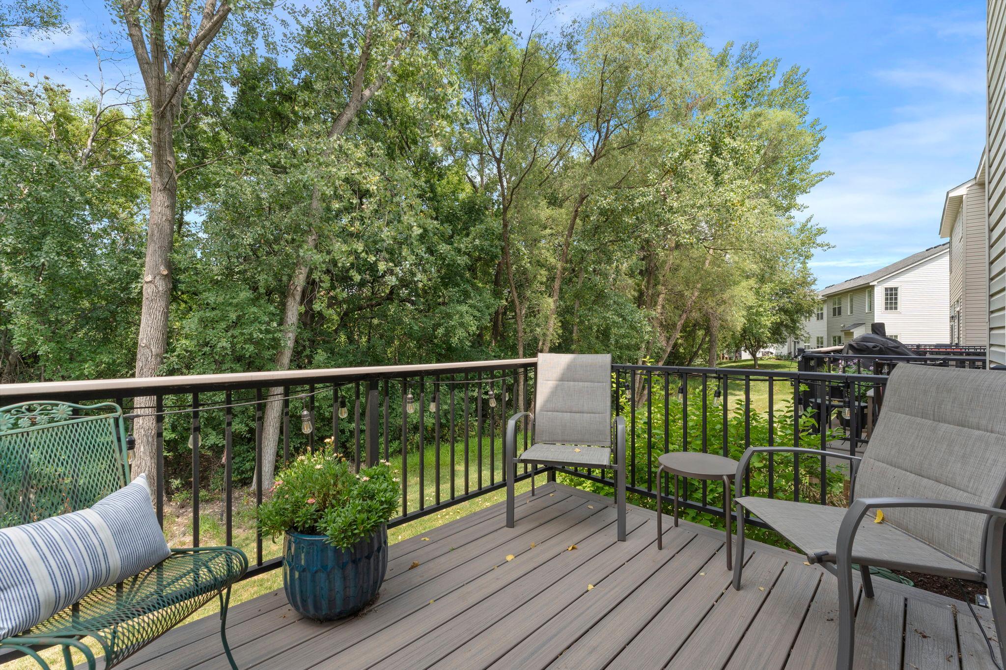 The 8x10 maintenance-free deck is the perfect place to enjoy your morning coffee while taking in views of the tree-lined backyard.