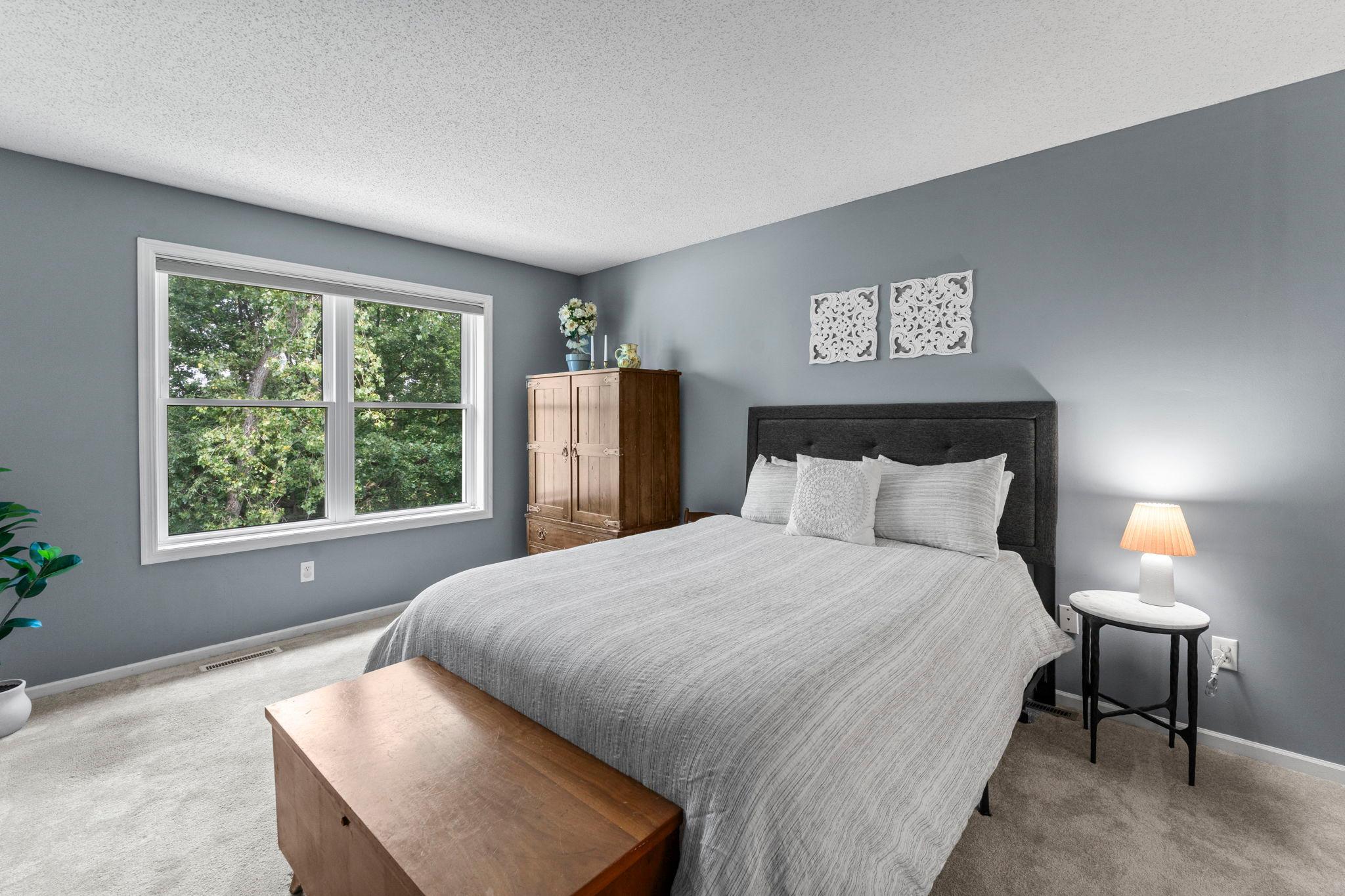 Also located on the upper level is the second bedroom with carpeting, a rear-facing window, and a 6x5 walk-in closet.