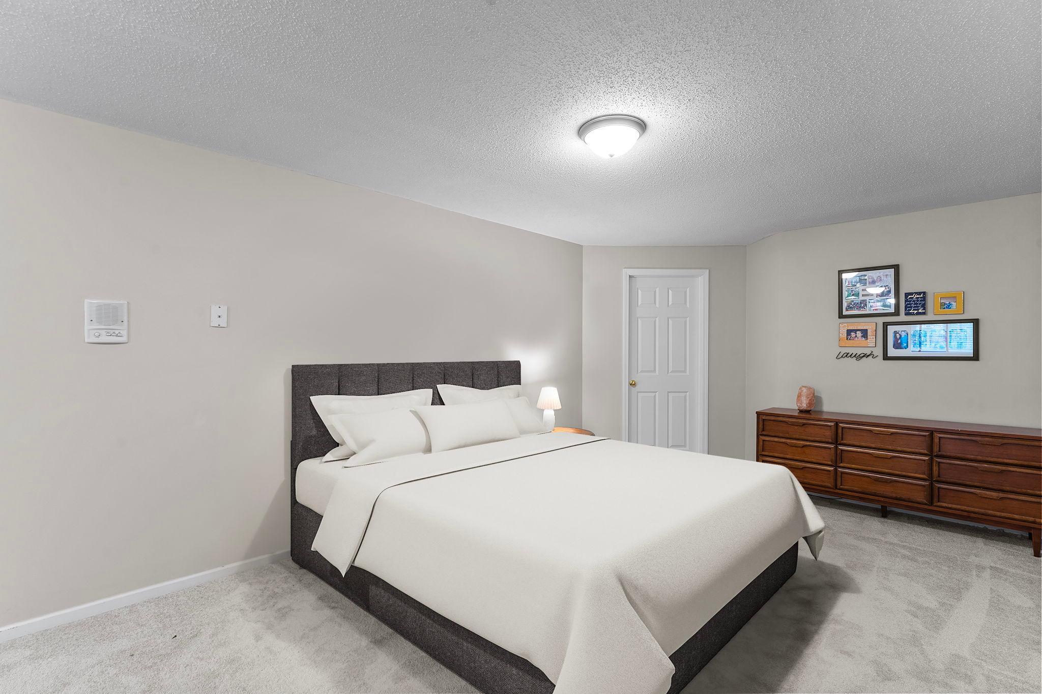 Nearby is a non-conforming third bedroom with a spacious 7x7 walk-in closet. *This photo is digitally staged*