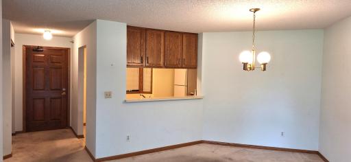 Dining Area at end of Living Room with pass-through window.jpg