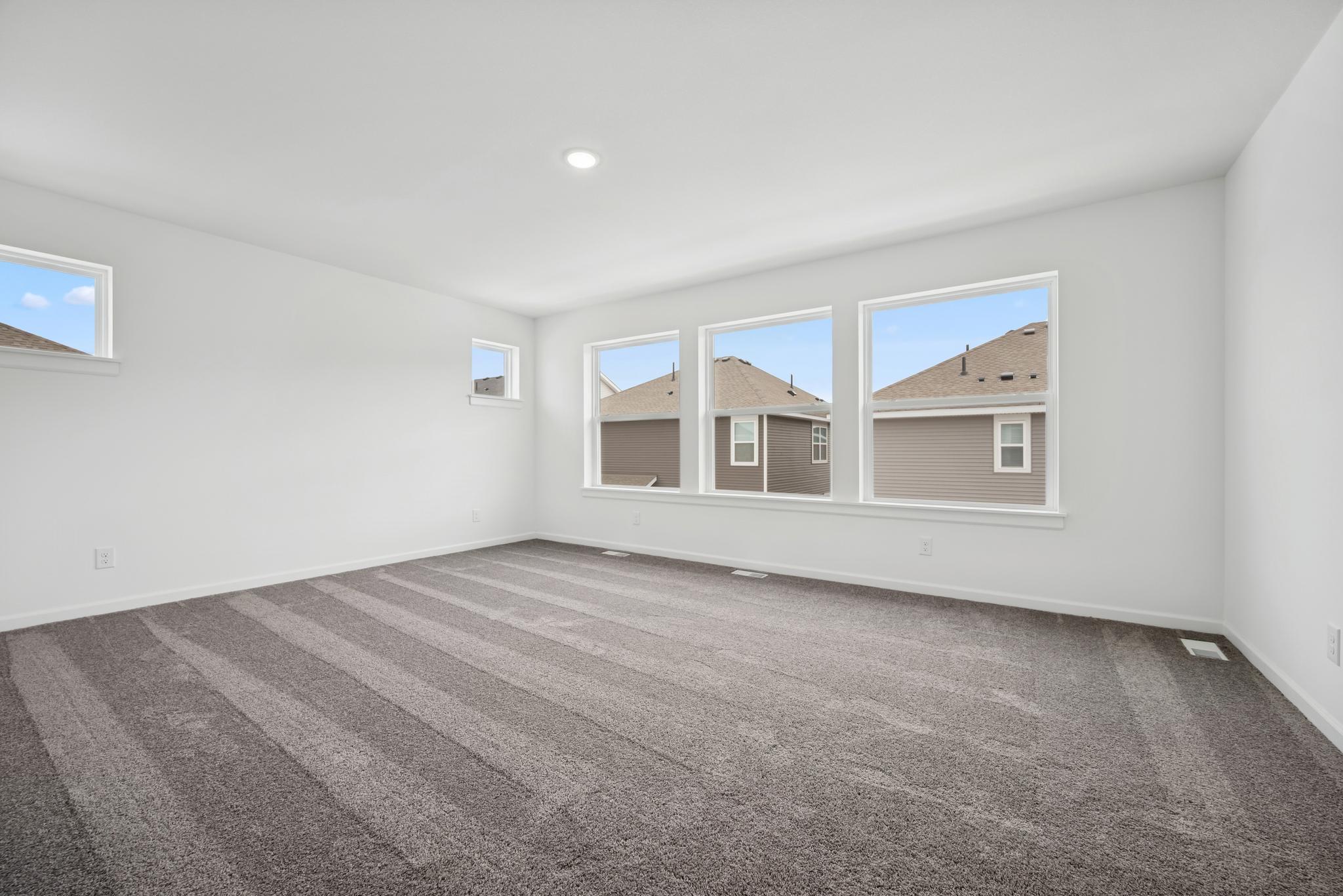 The expansive owner's suite: relax, recline, rest.. Pictures are of a previous Pryor home.