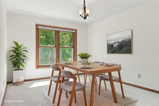 VIRTUALLY STAGED formal dining room.