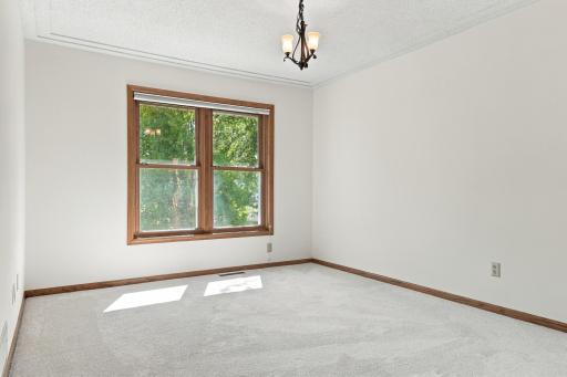 The formal dining room overlooks the backyard.