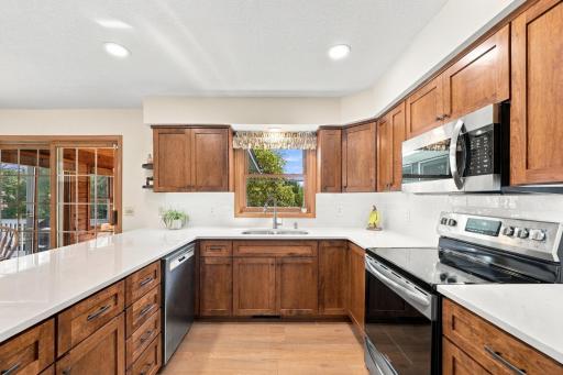 The kitchen features stainless steel appliances.