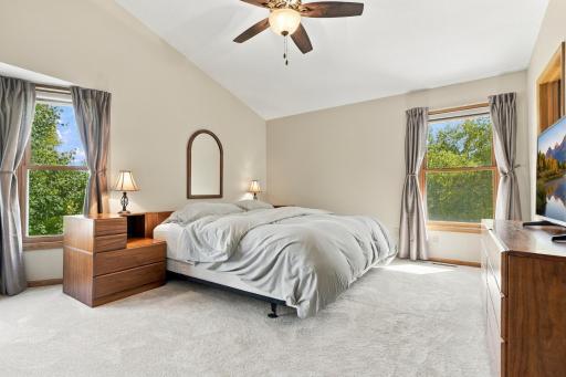 The primary bedroom is oversized with vaulted ceilings and a bay window.