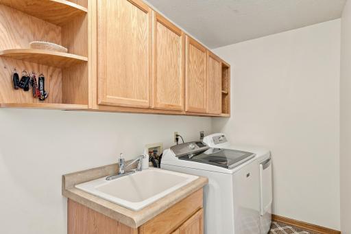 The laundry room is conveniently located next to the garage.