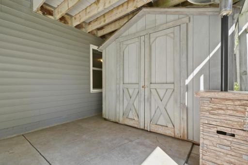 A shed under the deck offers extra storage space.