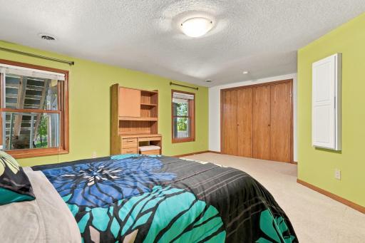 This bedroom is oversized with a large closet.