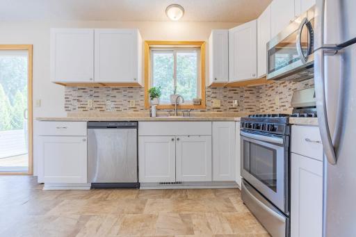 Kitchen window, peel and stick backsplash makes it easy to take down and put up what you love (No AI)