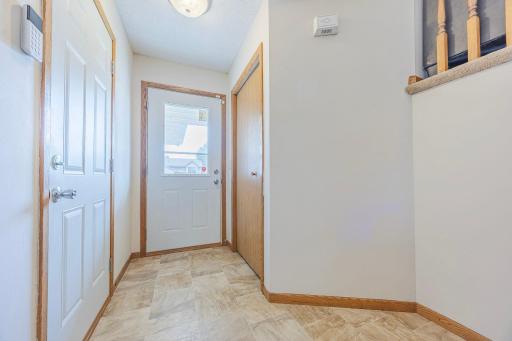 Garage door and front door to entry with coat closet (no AI)