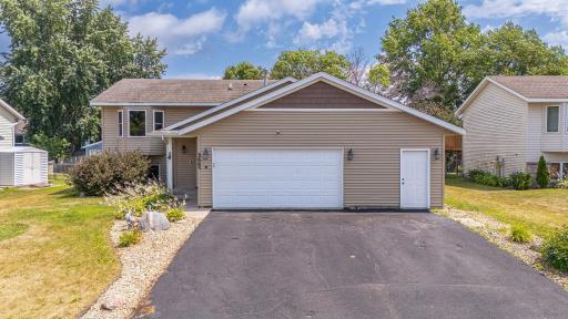 Adorable split-level home with massive garageâjust add your own 3rd stall door!
