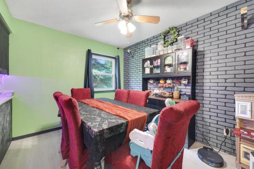 Dining room with faux brick accent wall