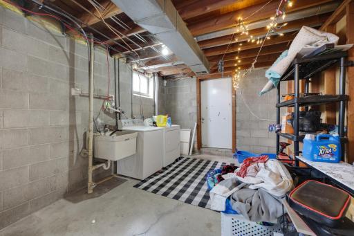 Nice and clean laundry area with handy garage access