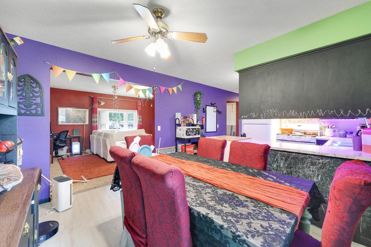 Kitchen cabinets have been painted with chalkboard paint for the kiddos