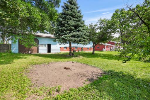Back yard and pass-through garage entrance for lawn tractor or other conveniences