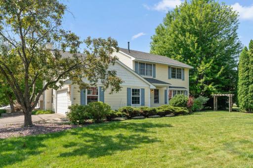 Photo for 8020 Hidden Court, Chanhassen, MN 55317 - listing #7114655 "Set on a beautifully landscaped corner lot with an expansive front lawn, mature trees, and charming garden arbor, this home offers exceptional curb appeal before you even step inside."