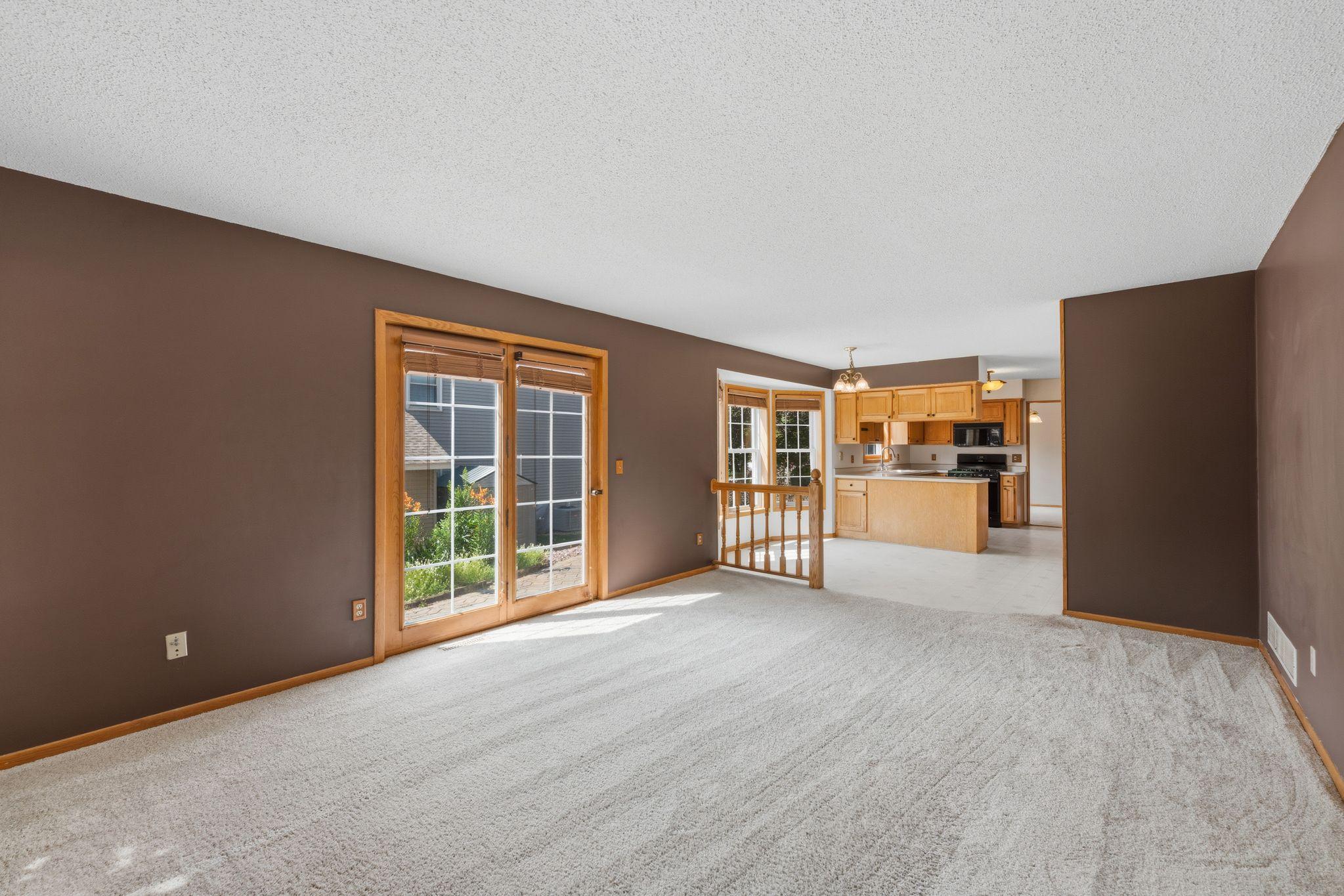 Large windows and patio doorsnbring the outdoors in.