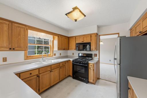 Kitchen has abundant cabinetry and generous workspaces make meal prep easy!