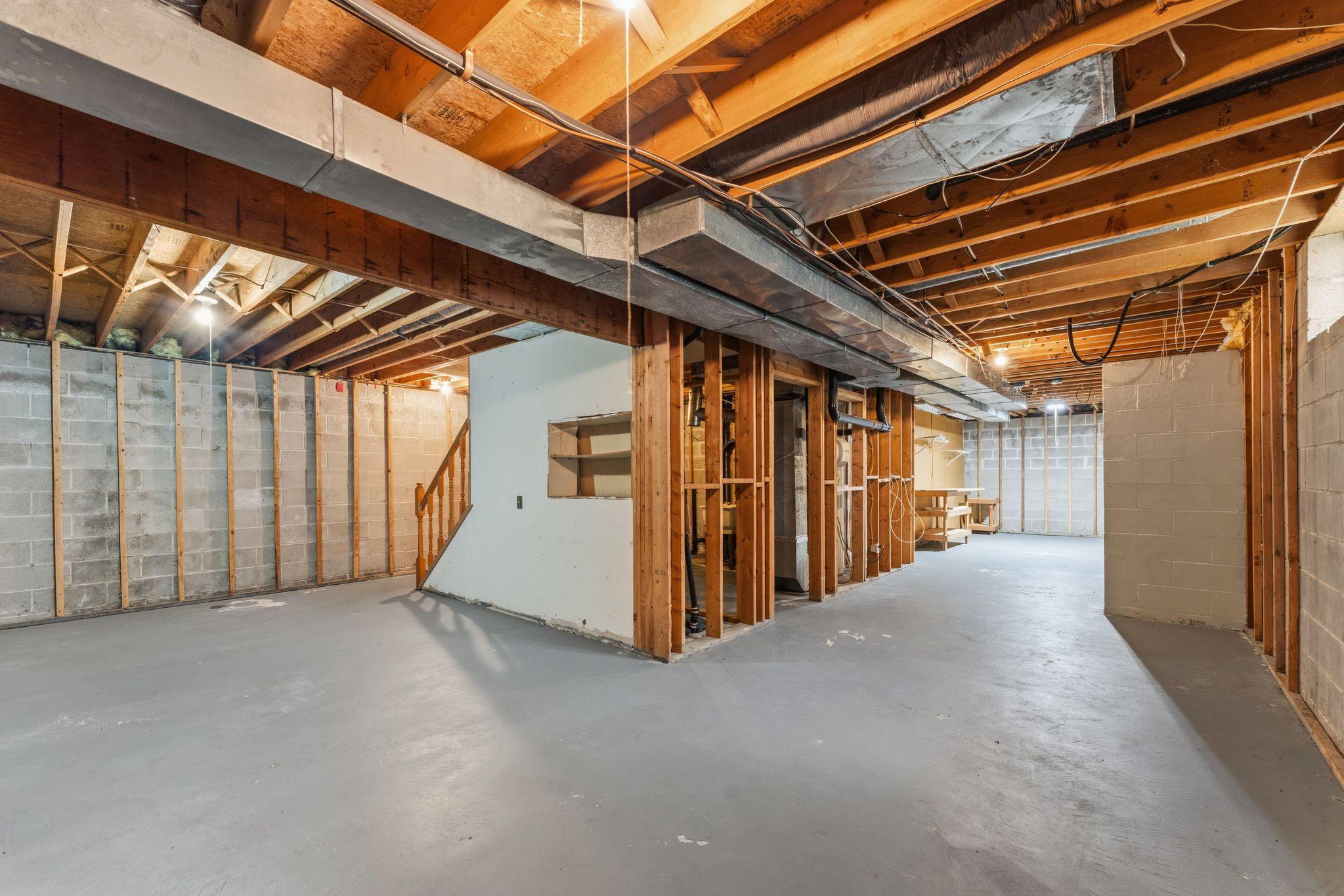 Unfinished basement has a clean slate offering incredible potential to customize thespace to fit your needs.