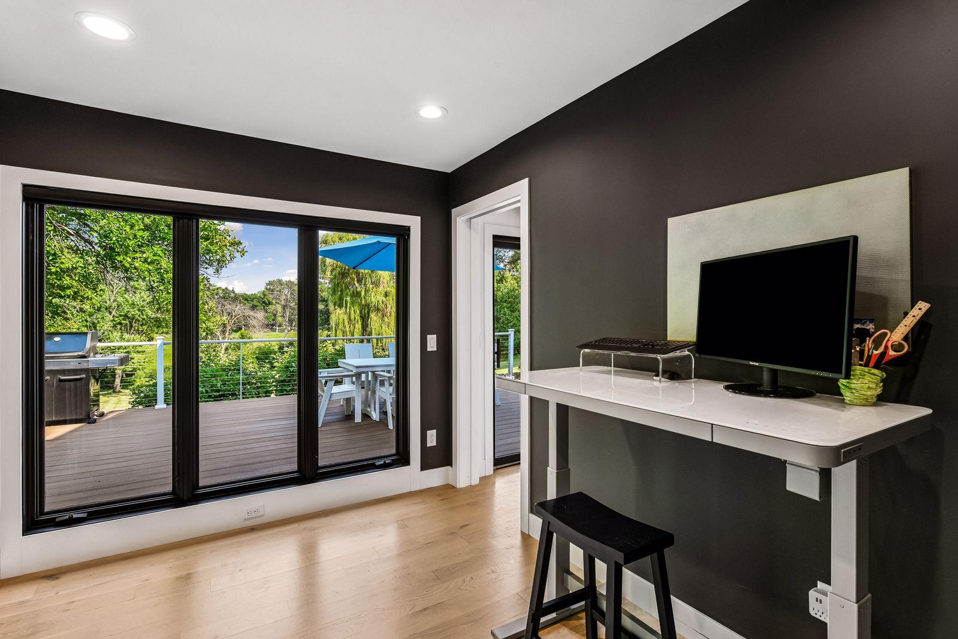 A private office, mudroom, and powder room complete the main level.