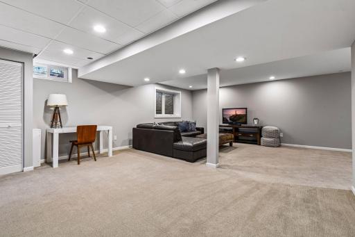 The lower level expands the home's living space with a spacious family room and game area.