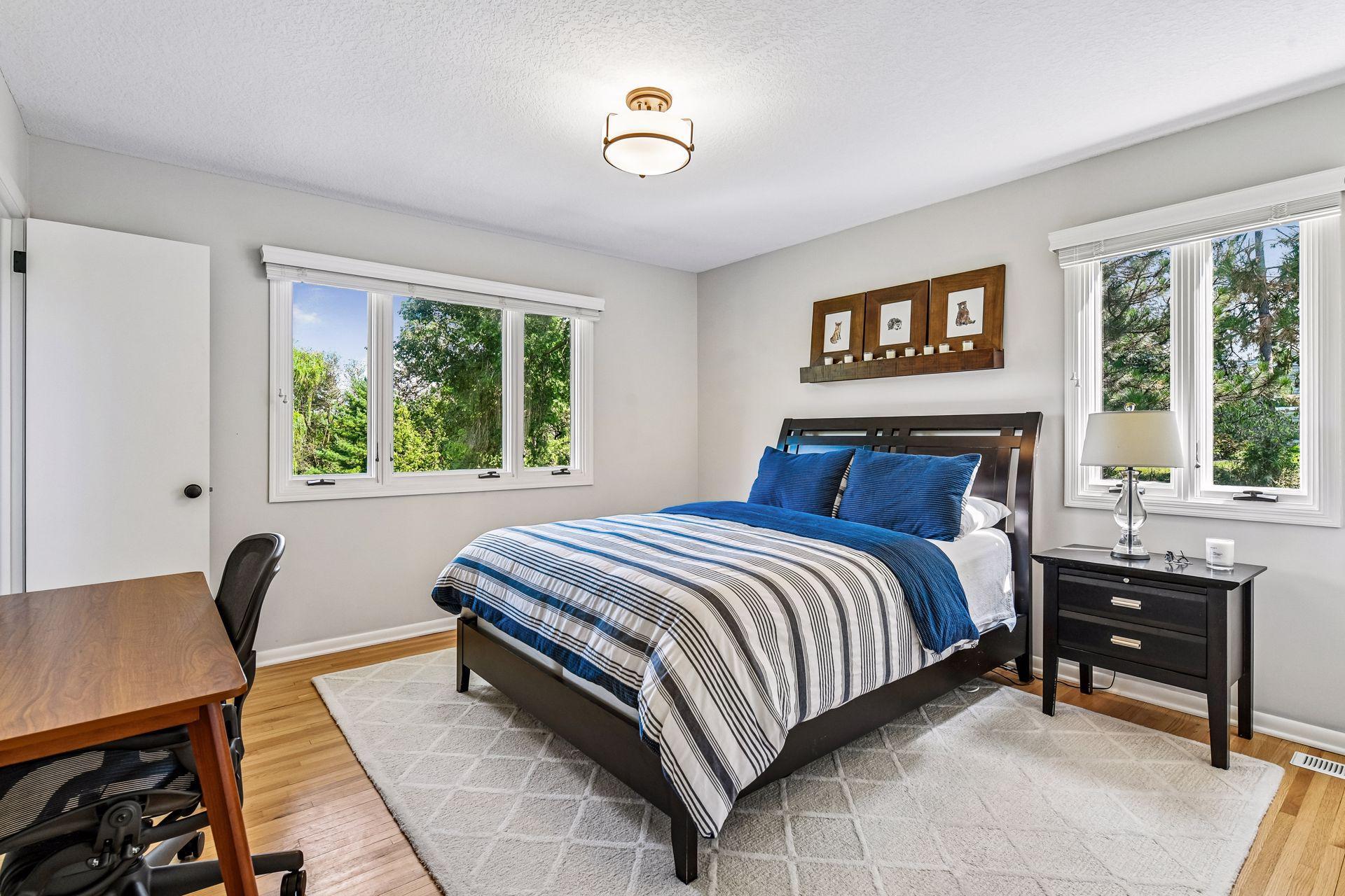 Three additional bedrooms and two bathrooms provide ample space for family and guests.