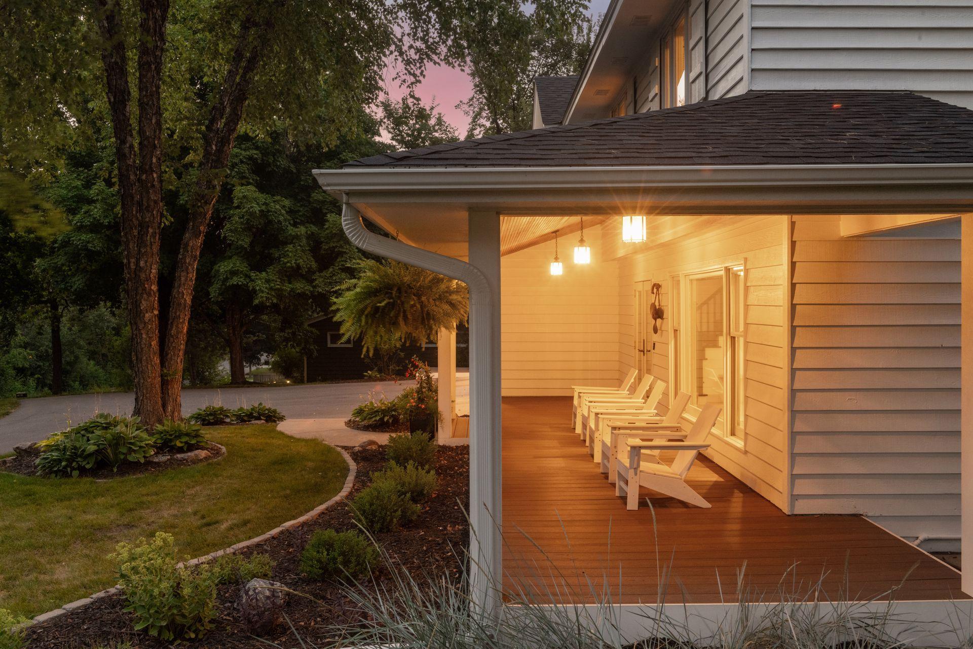 The charming front porch welcomes you inside, where an inviting foyer leads to the inviting family room anchored by a fireplace and hardwood floors.