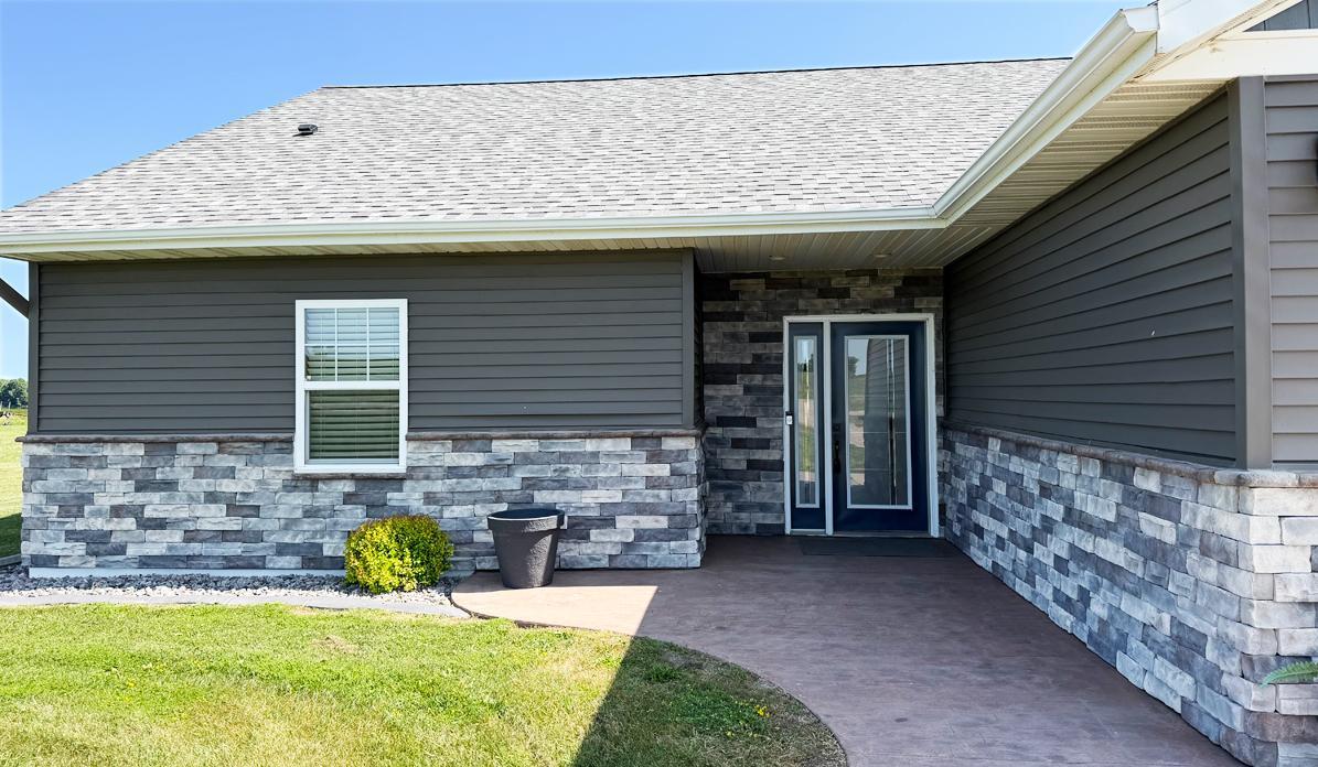 04 Front-Stone-StampedPorch.jpg