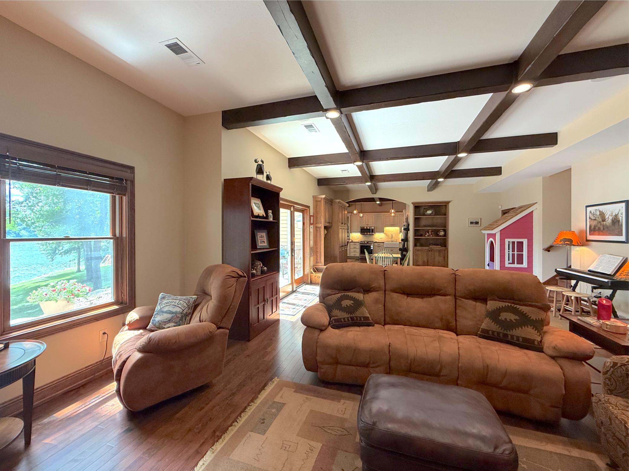 Designed for gathering and relaxation, the lower level showcases exceptional craftsmanship, and abundant natural light.