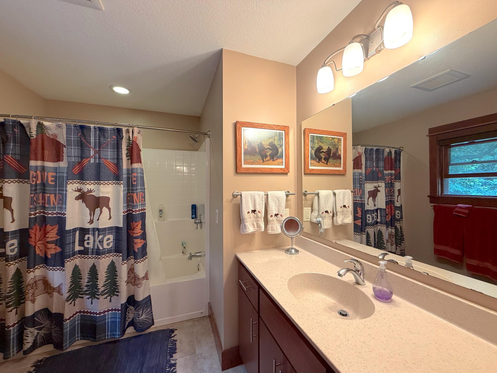 Conveniently located on the upper level, this full bathroom provides ample space and everyday convenience for residents and visitors.