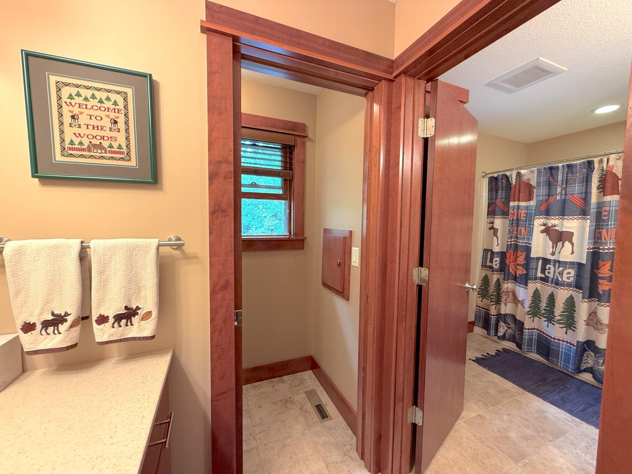 The upper-level bathroom offers a spacious layout with timeless finishes and convenient access to nearby bedrooms.