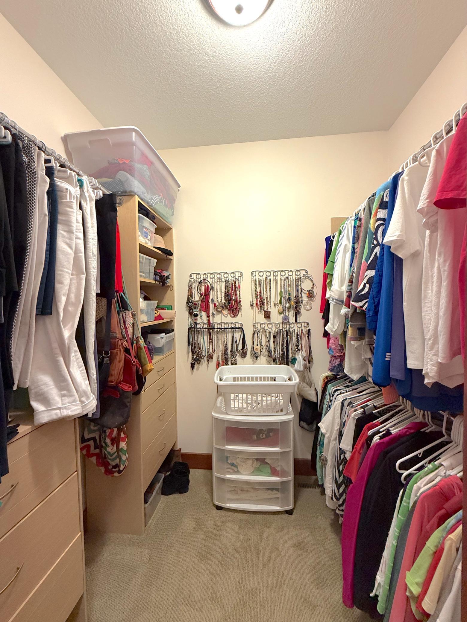 The spacious primary suite is complemented by separate dual walk-in closets, providing exceptional storage and organization.